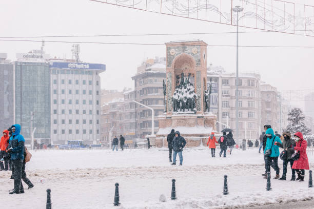 Istanbul, Turkey - January 7, 2017: Republic Monument at Taksim Square in a snowy winter day in Beyoğlu