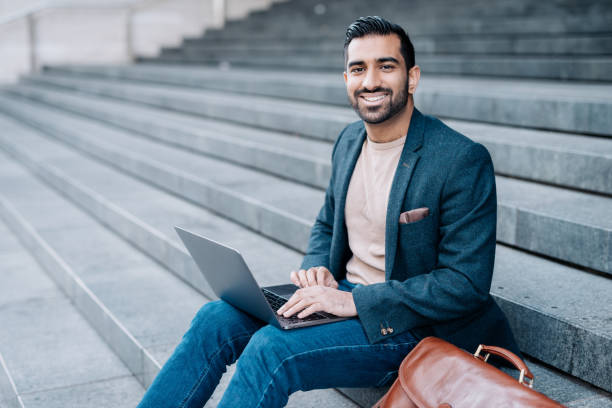 istock Businessman in India using laptop for electronic banking 902441700
