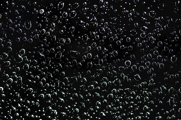 istock water drops on the glass night 902452504