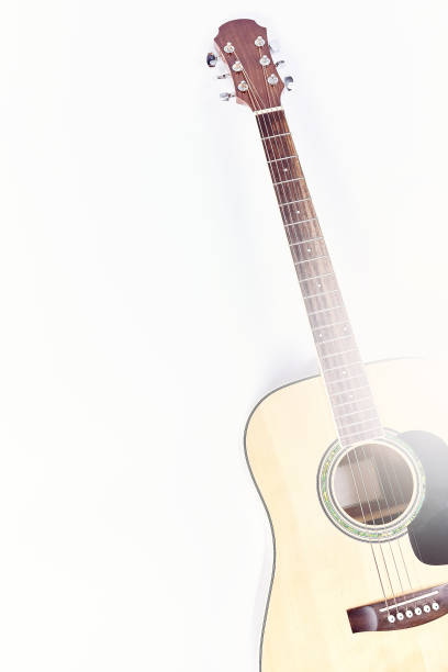 istock Acoustic guitar isolated on white background . 902459192