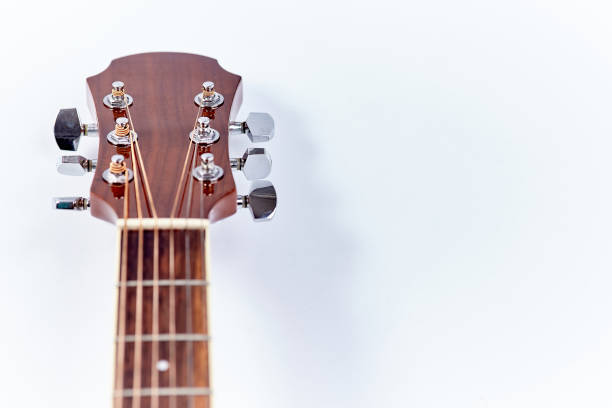 istock Acoustic guitar isolated on white background . 902459200