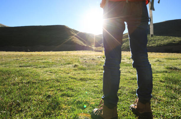 istock one backpacking woman hiking in sunrise mountains 902461214