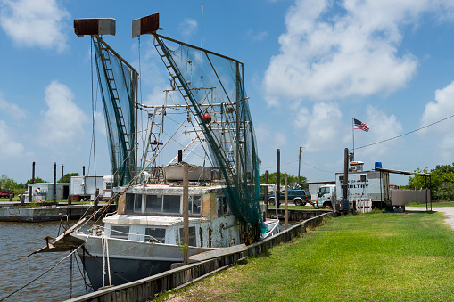 Lake Charles, Louisiana- June 15, 2014: Old shrimp trawler in a port in the banks of Lake Charles in the State of Louisiana, USA