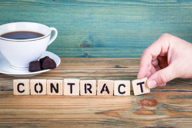 istock contract. Wooden letters on the office desk, informative and communication background 902470514