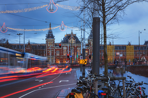 Long exposure. A crowd walking over Damrak avenue in central Amsterdam, Netherlands.