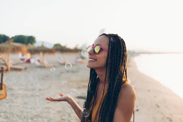 istock Young woman having fun on beach 902479920