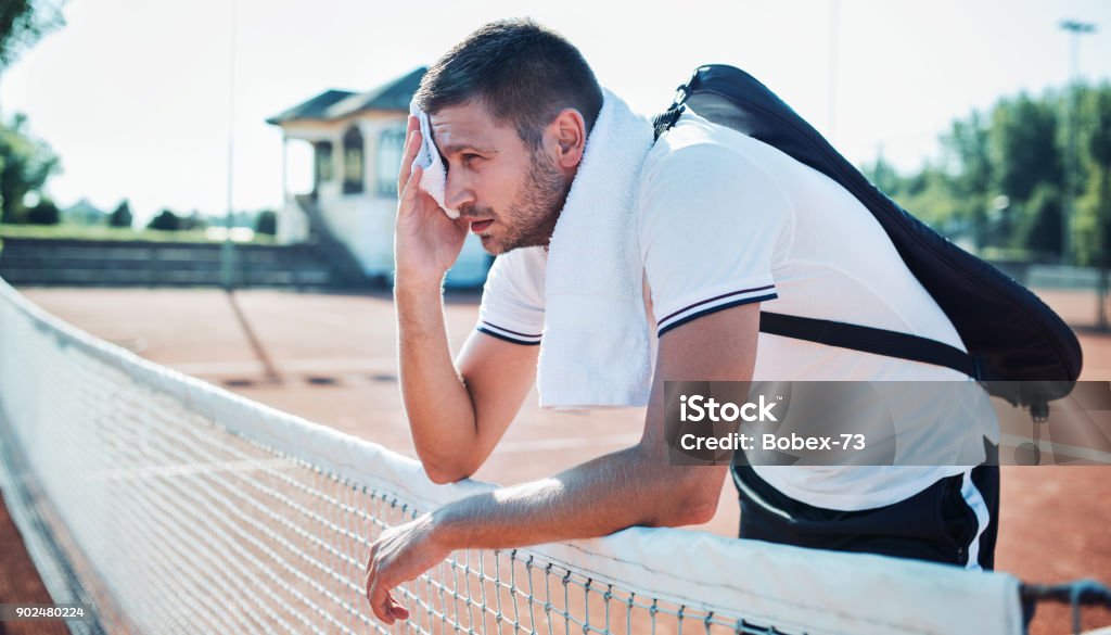 Tennis player. Sport, recreation concept Tennis player resting on the court after the metch. Sport, recreation concept Ace Stock Photo Tennis player. Sport, recreation concept Tennis player resting on the court after the metch. Sport, recreation concept Ace Stock Photo