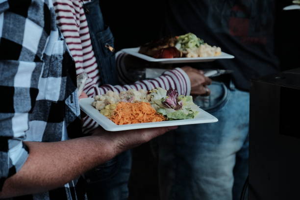 istock Midsection Of People Having Food 902484792
