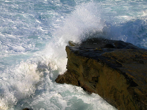 Ocean Wave Crashing on Rock stock photo