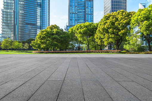 Empty brick floor with city skyline background