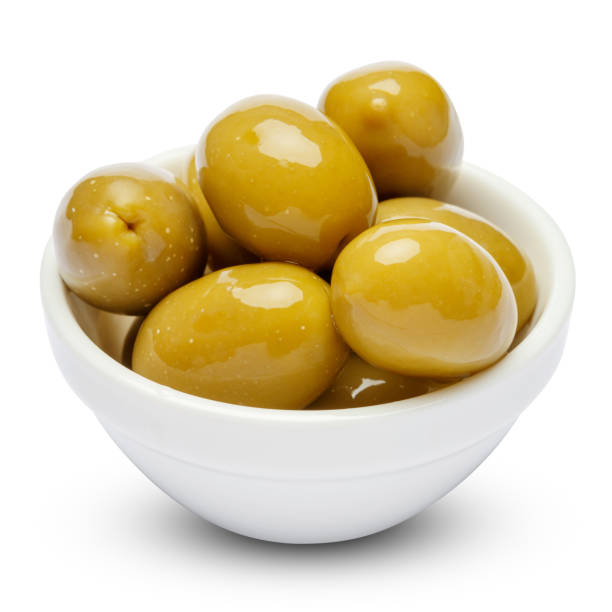 istock green olives in white bowl on white background 902488192