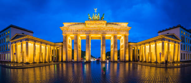 istock Berlin Brandenburg Gate iconic landmark panorama illuminated at dusk Germany 902488448
