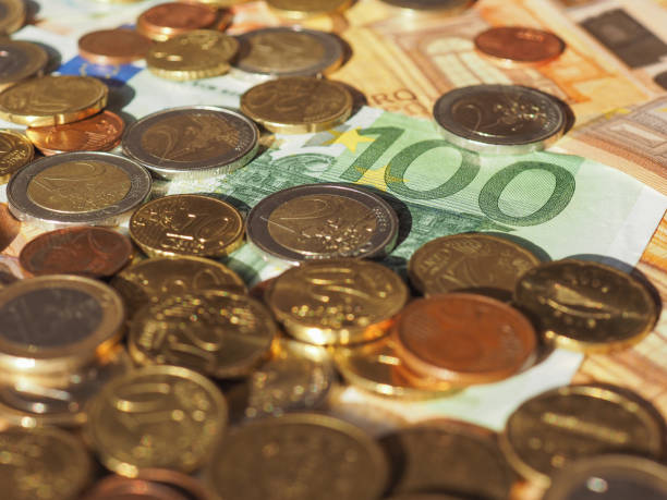 istock Euro notes and coins, European Union 902492662