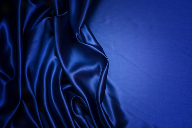 istock Blue fabric background and texture, Crumpled of blue satin for abstract 902493624