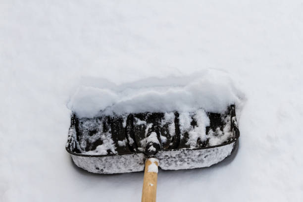 istock Shovel on the white snow 902497502