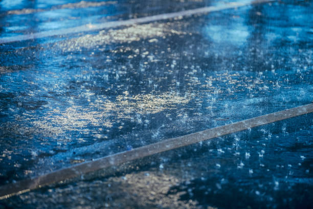 istock colored lights reflected in the wet asphalt in the rain 902500936