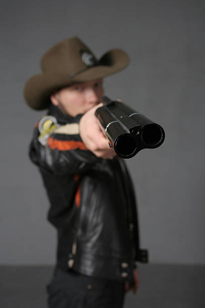 istock Bah-bah. Cowboy with a double-barreled shotgun 90250268