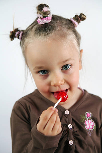 istock Small girl with lollipop 90250727