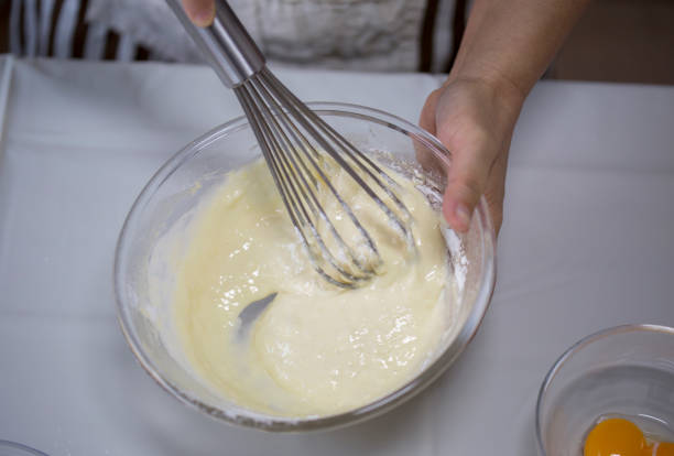 istock stirring milk and flour to make cookies 902512468