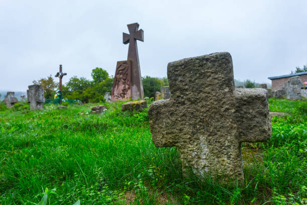 istock old medieval cemetery at the misty day 902516734