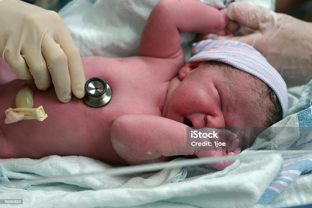 Newborn baby in hospital crying A newborn baby checkup Caesarean Section Stock Photo
