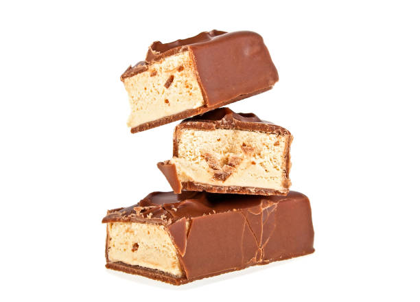 istock Chocolate bar with nougat isolated on a white background 902521140