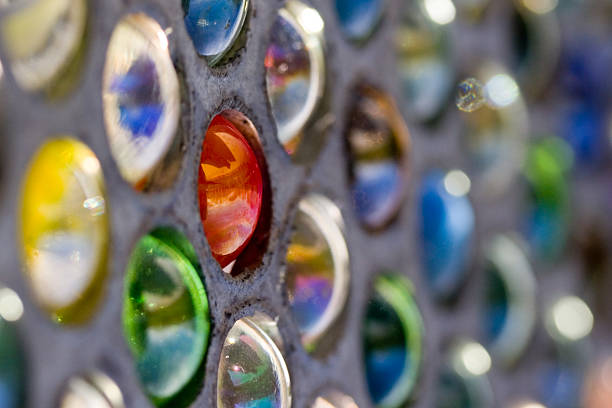 a metal grate filled with coloured marbles