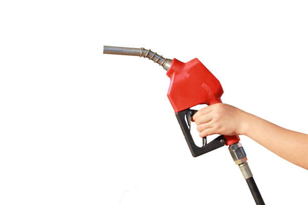 istock Woman hand holding a fuel nozzle on white background 902527700