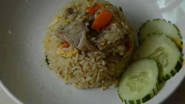 fried rice with pork squeezing lemon and dressing chili fish sauce