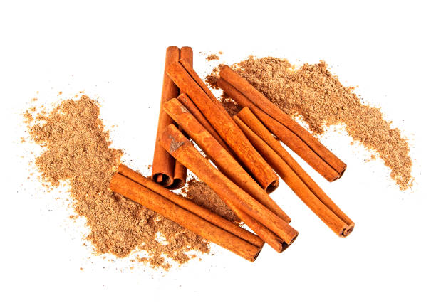 istock Cinnamon sticks and cinnamon powder, image on a white background 902549062