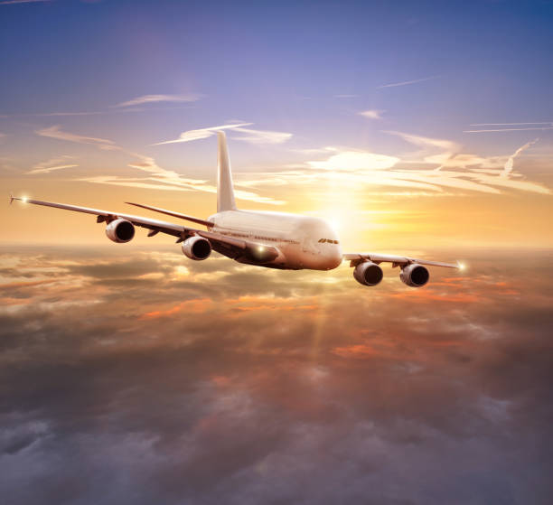 istock Huge commercial airplane flying above clouds 902553340