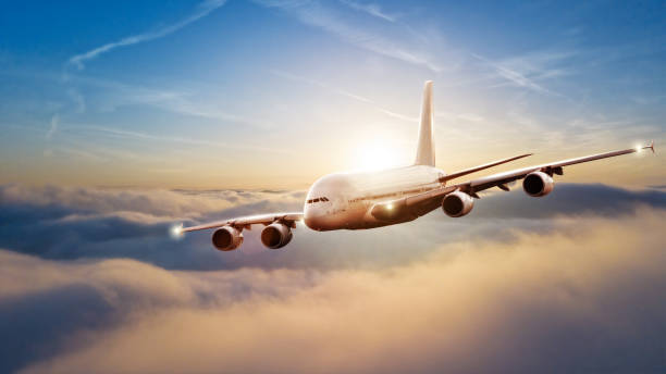 istock Huge commercial airplane flying above clouds 902553412
