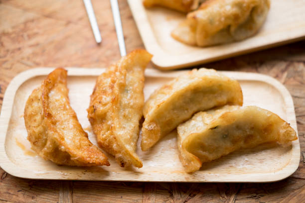 istock Deep fried gyoza crispy and golden colour 902571760