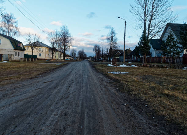 istock Dirt road in poor countryside 902572980