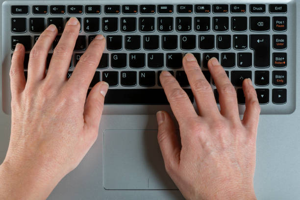 istock Female hands typing on a laptop 902582790