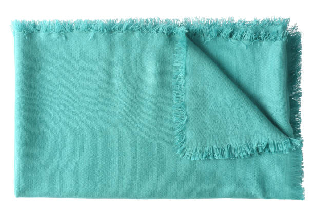 istock Light sea green color folded wool shawl blanket isolated on white 902584090