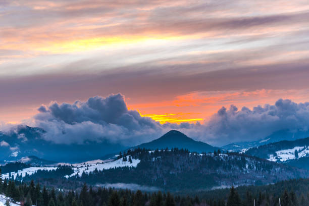 istock Winter sunset in Tihuta, Romania 902584452