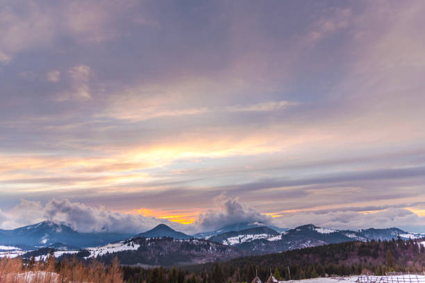 istock Winter sunset in Tihuta, Romania 902584572