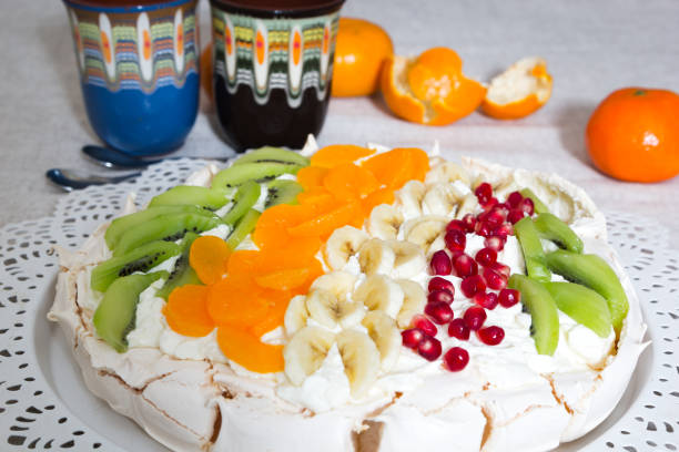 istock Pavlova cake with fruit on a white plate. 902588290