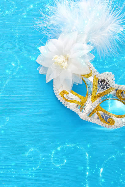 istock Image of elegant venetian mask over colorful background. 902590888