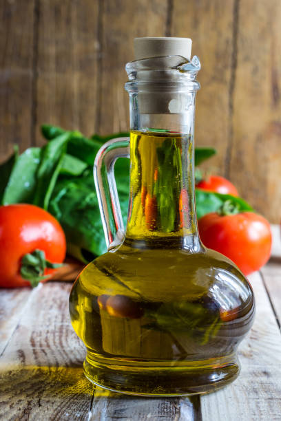 istock Tomato spinach leaves and olive oil 902591912