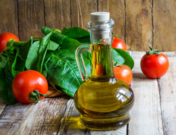 istock Tomato spinach leaves and olive oil 902591916