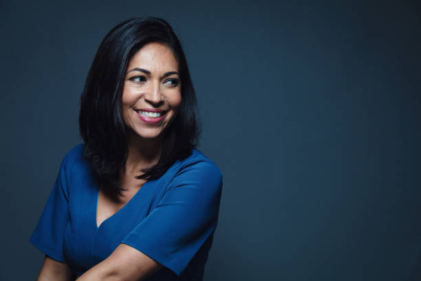 istock Happy smiling hispanic woman looking away 902595990