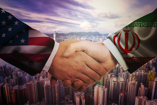 United States and Iran diplomats agreeing on a deal.