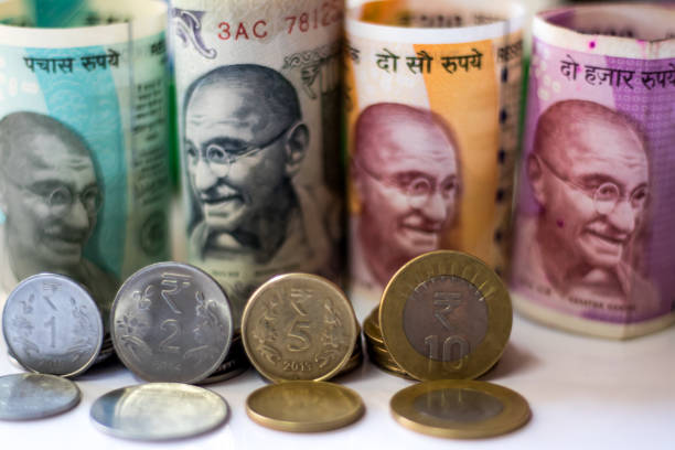 istock Image of Currency and coins with growth concept 902601990