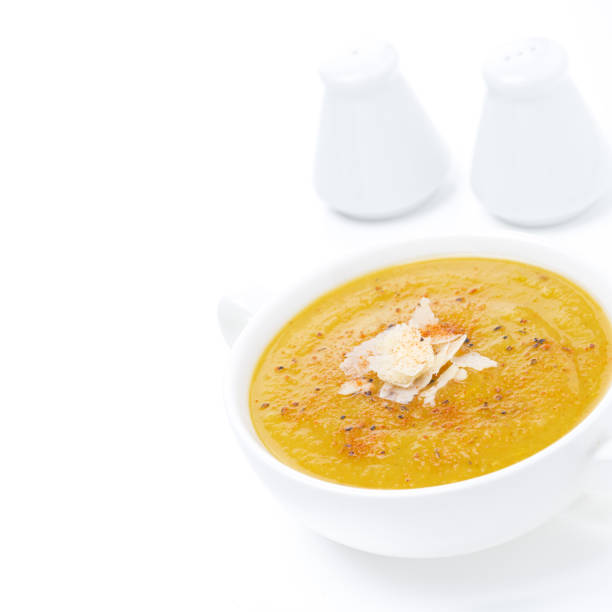 istock soup of yellow lentils with vegetables, isolated on white 902605110