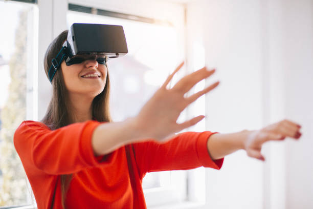 istock Young girl wearing Virtual reality glass. 902605298