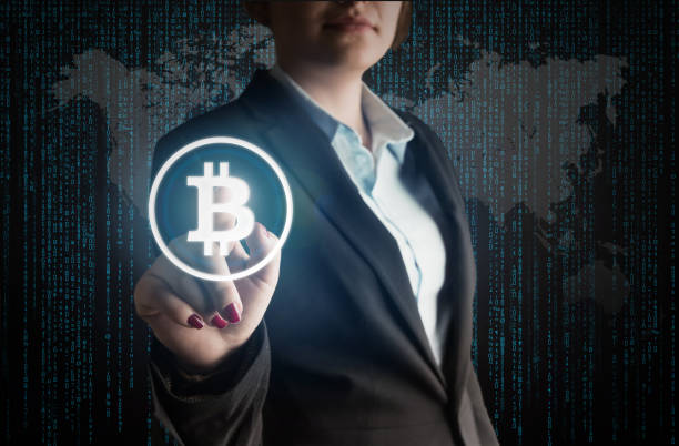 istock Business Woman touch bitcoin sign 902605432