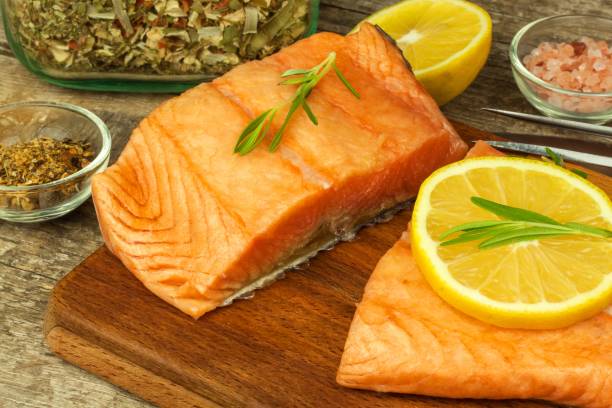 istock Frozen salmon on the kitchen table. Diet food. Home cooking fish. 902606852