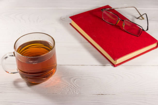 Iced tea and computer on a wooden table
